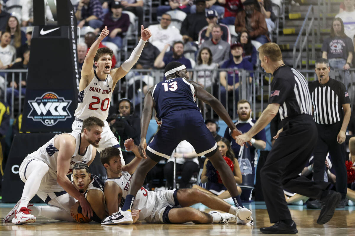 The St. Mary's Gaels struggle with the Gonzaga Bulldogs for the ball during the second half of ...