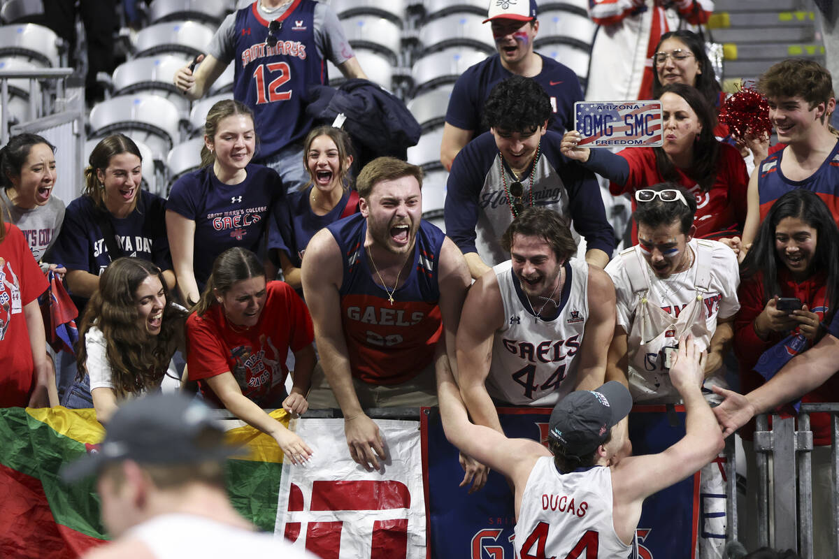 St. Mary's Gaels fans cheer as St. Mary's Gaels guard Alex Ducas celebrates their win after an ...