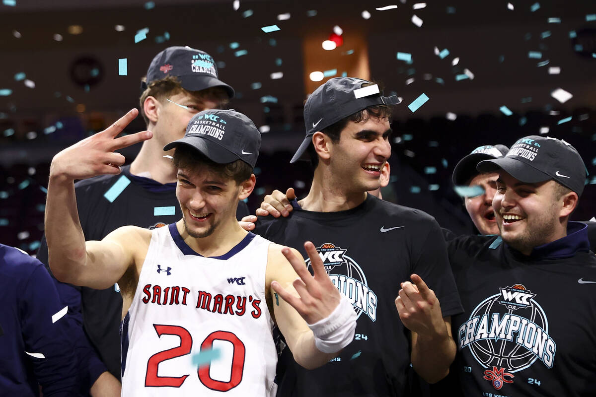 St. Mary's Gaels guard Aidan Mahaney (20) celebrates with his team after winning an NCAA colleg ...