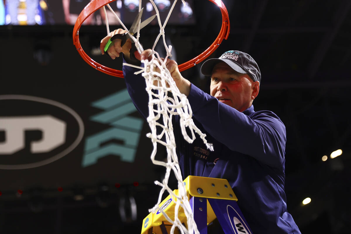 St. Mary's Gaels head coach Randy Bennett cuts the net after his team won an NCAA college baske ...