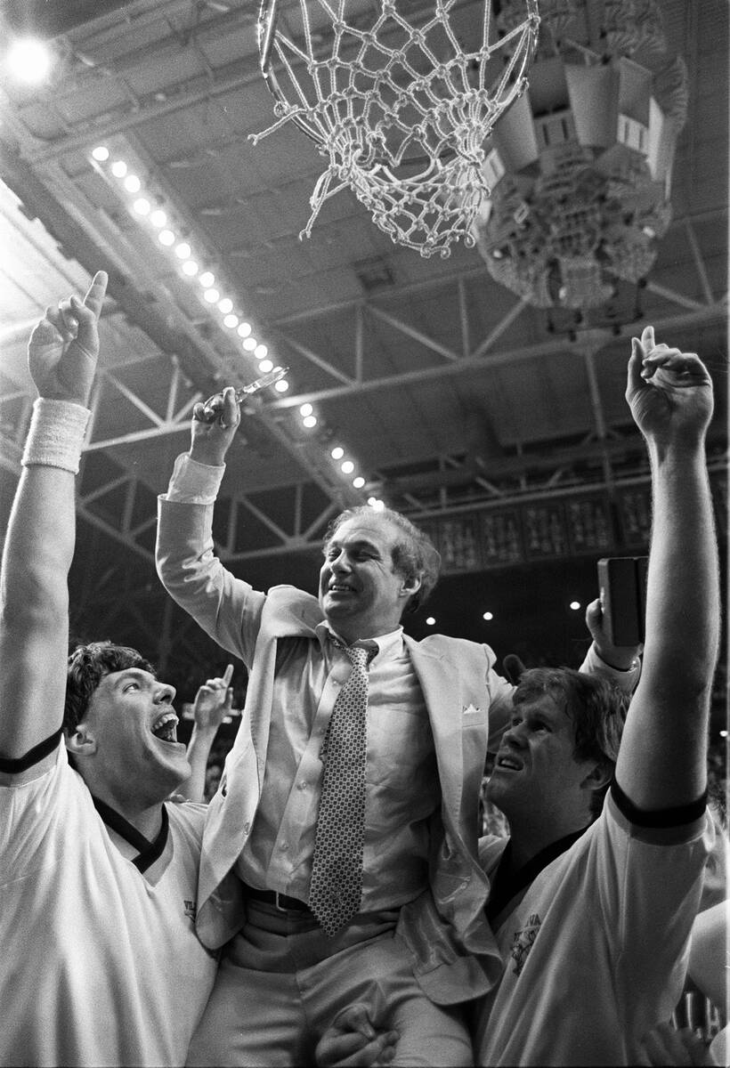 FILE - In this April 1, 1985, file photo, Villanova coach Rollie Massimino is lifted up to cut ...