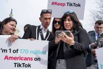 Devotees of TikTok monitor voting at the Capitol in Washington, as the House passed a bill that ...