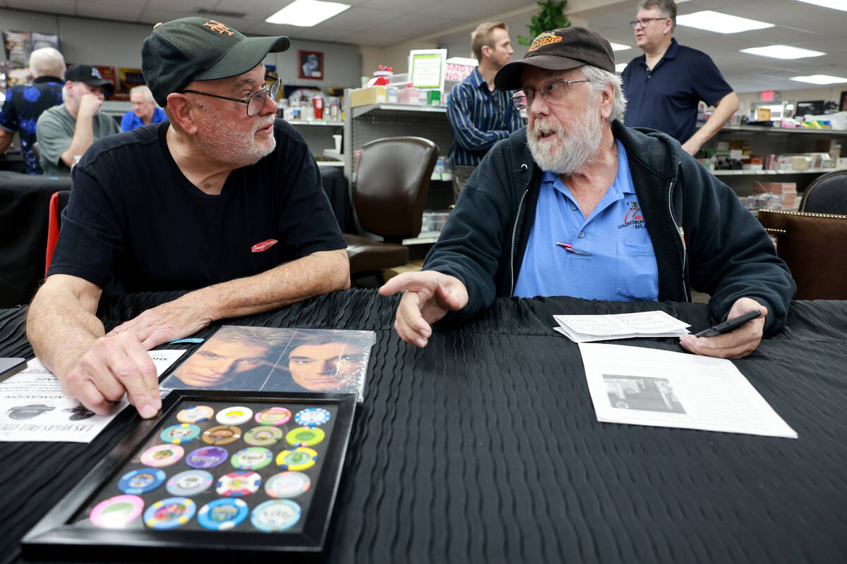 Rigo Villarnovo, 77, left, talks about his collection of $2 chips with Jim Follis, 71, before a ...