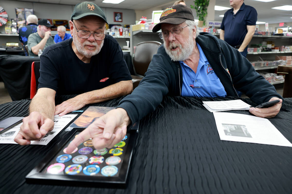 Rigo Villarnovo, 77, left, talks about his collection of $2 chips with Jim Follis, 71, before a ...