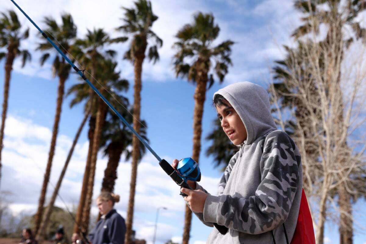 Angelo Garcia, 11, concentrates as a fish nibbles on his bait during a Latino Outdoors fishing ...