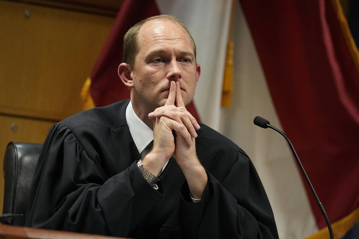 FILE - Fulton County Superior Judge Scott McAfee presides in court, Feb. 27, 2024, in Atlanta. ...