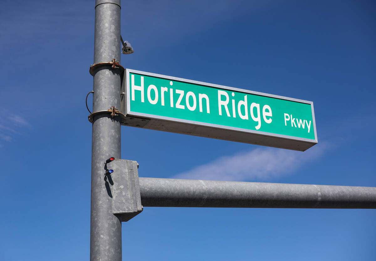 Red light indicators on a street light pole at the intersection of Eastern Avenue and Horizon R ...