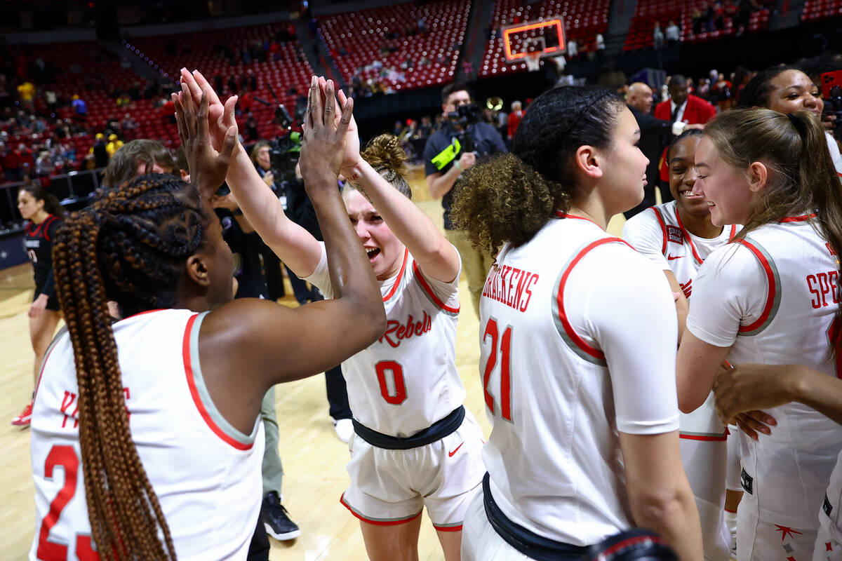 UNLV Lady Rebels center Desi-Rae Young, left, and guard Ashley Scoggin (0) high five after winn ...