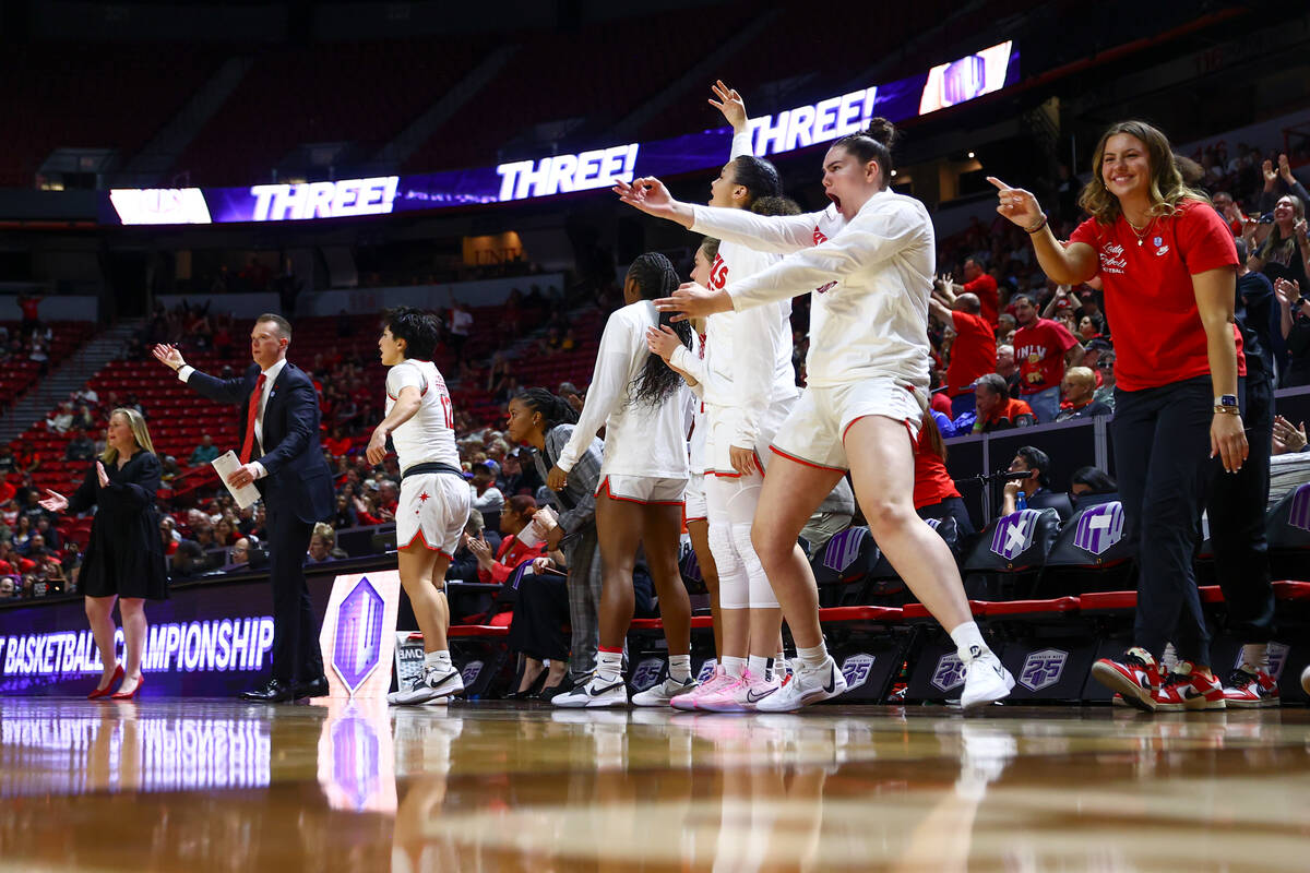The UNLV Lady Rebels bench celebrates a 3-point basket during the second half of an NCAA colleg ...