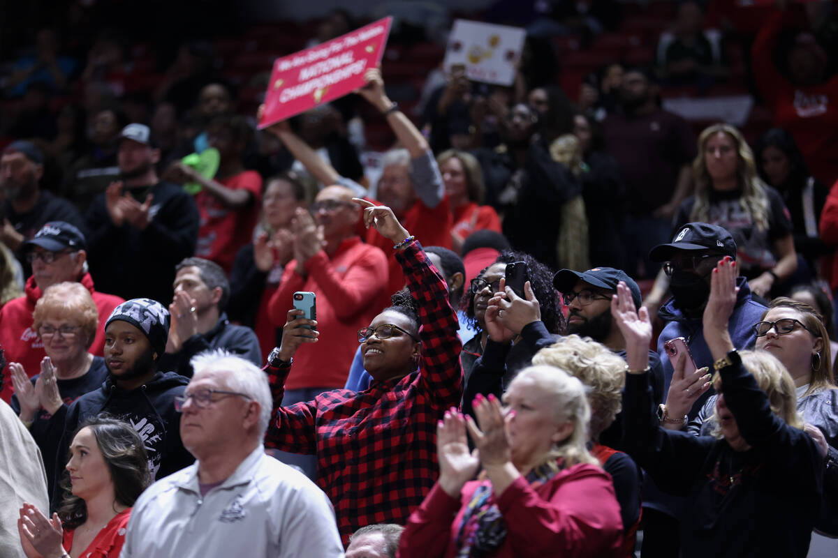 UNLV Lady Rebels fans cheer as their team is winning during the second half of an NCAA college ...