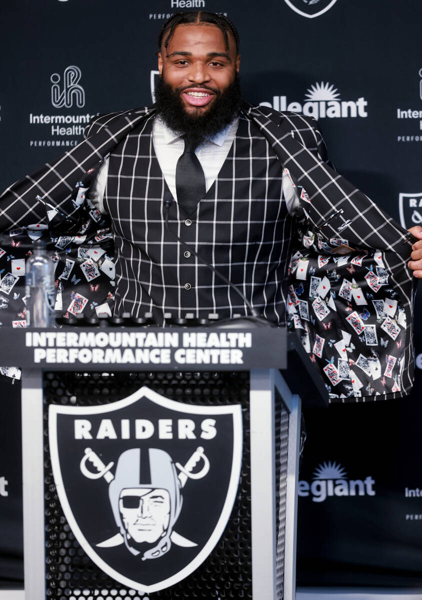 New Raiders defensive tackle Christian Wilkins shows his jacket featuring blackjack hands while ...
