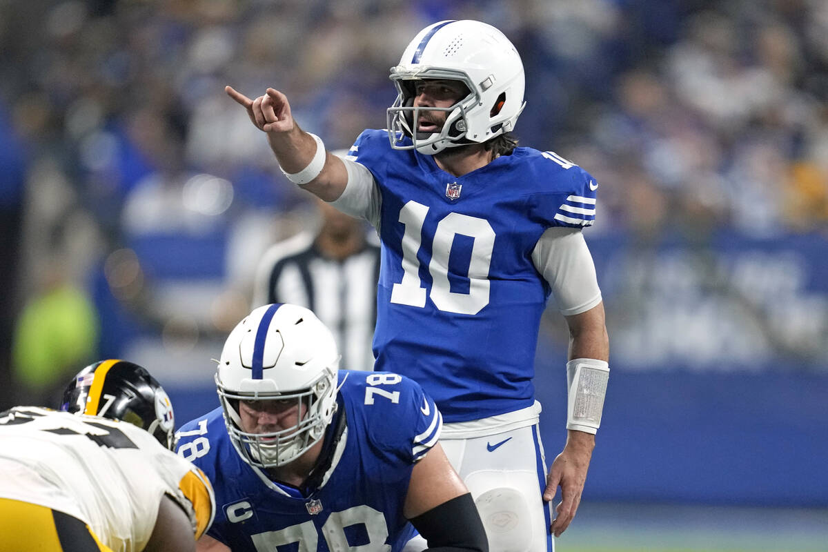 Indianapolis Colts quarterback Gardner Minshew (10) lines up behind center Ryan Kelly (78) during...