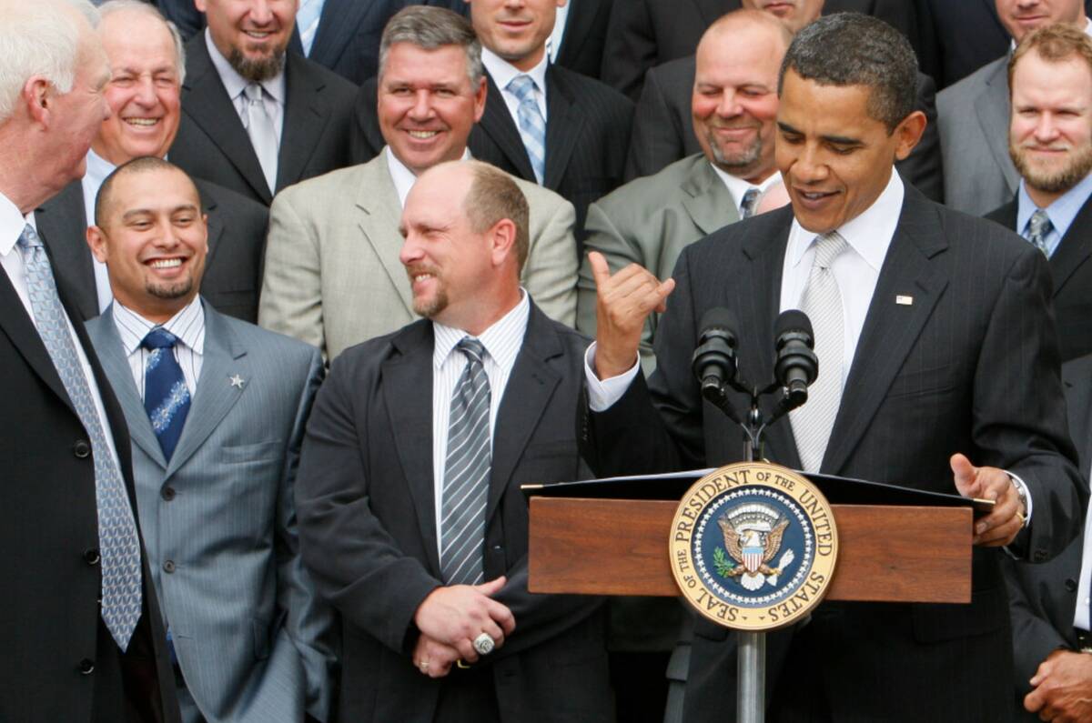 President Barack Obama makes the Hawaiian "shaka" hand sign as he acknowledges Philadelphia Phi ...