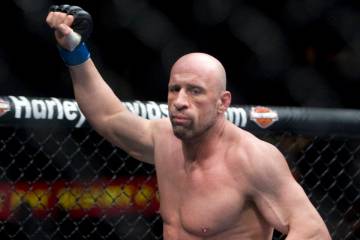 Ultimate Fighting Championship fighter Mark Coleman runs into the octagon prior to taking on hi ...