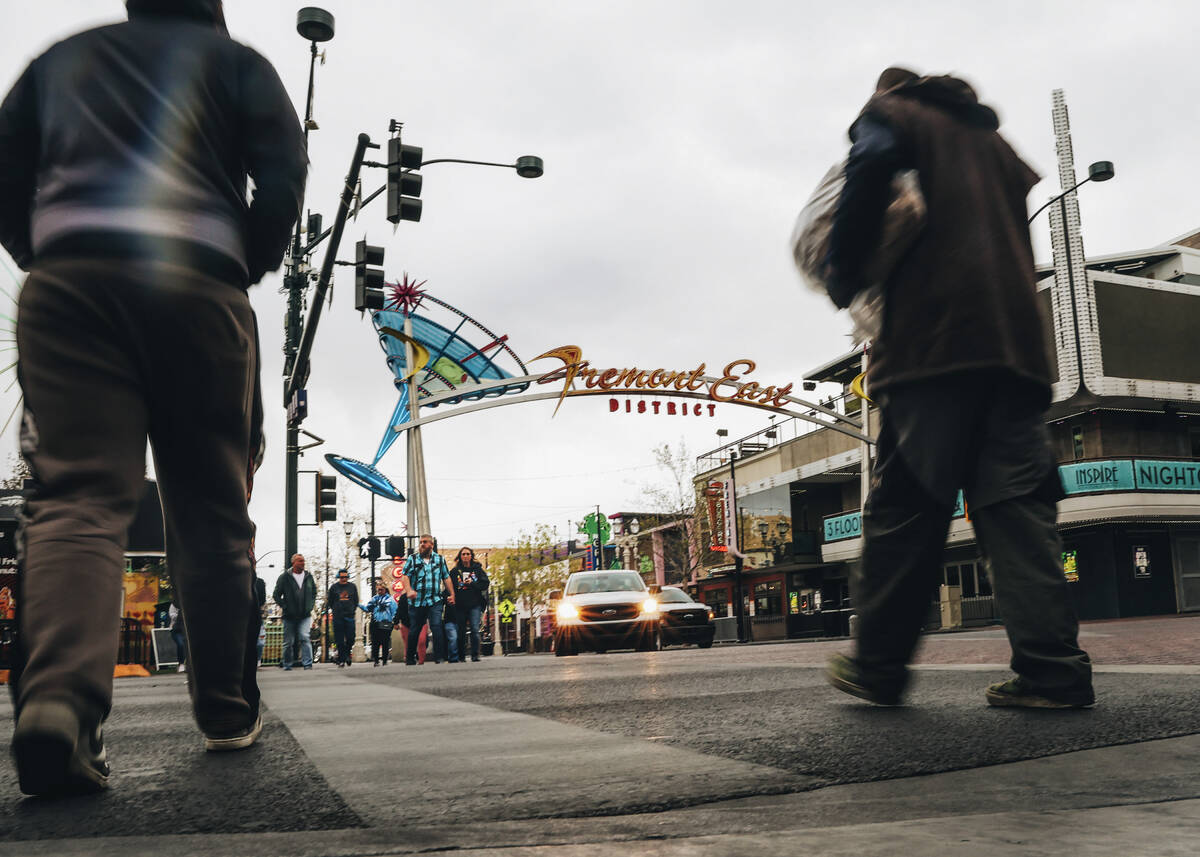 Pedestrians cross the street at Fremont Street Experience on Thursday, March 14, 2024, in Las V ...