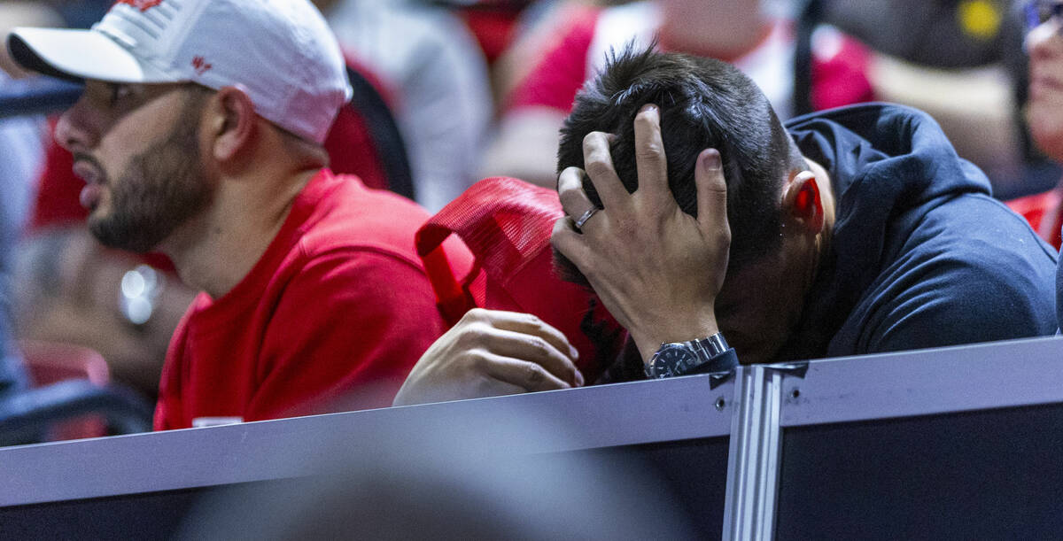 A UNLV Rebels fan is dejected as the San Diego State Aztecs keep the lead during the second hal ...