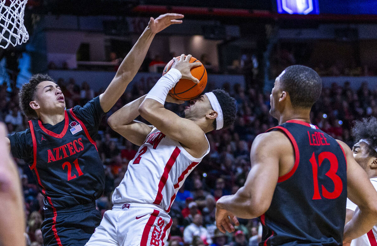 UNLV Rebels guard Justin Webster (2) has the ball pushed back into his face by San Diego State ...