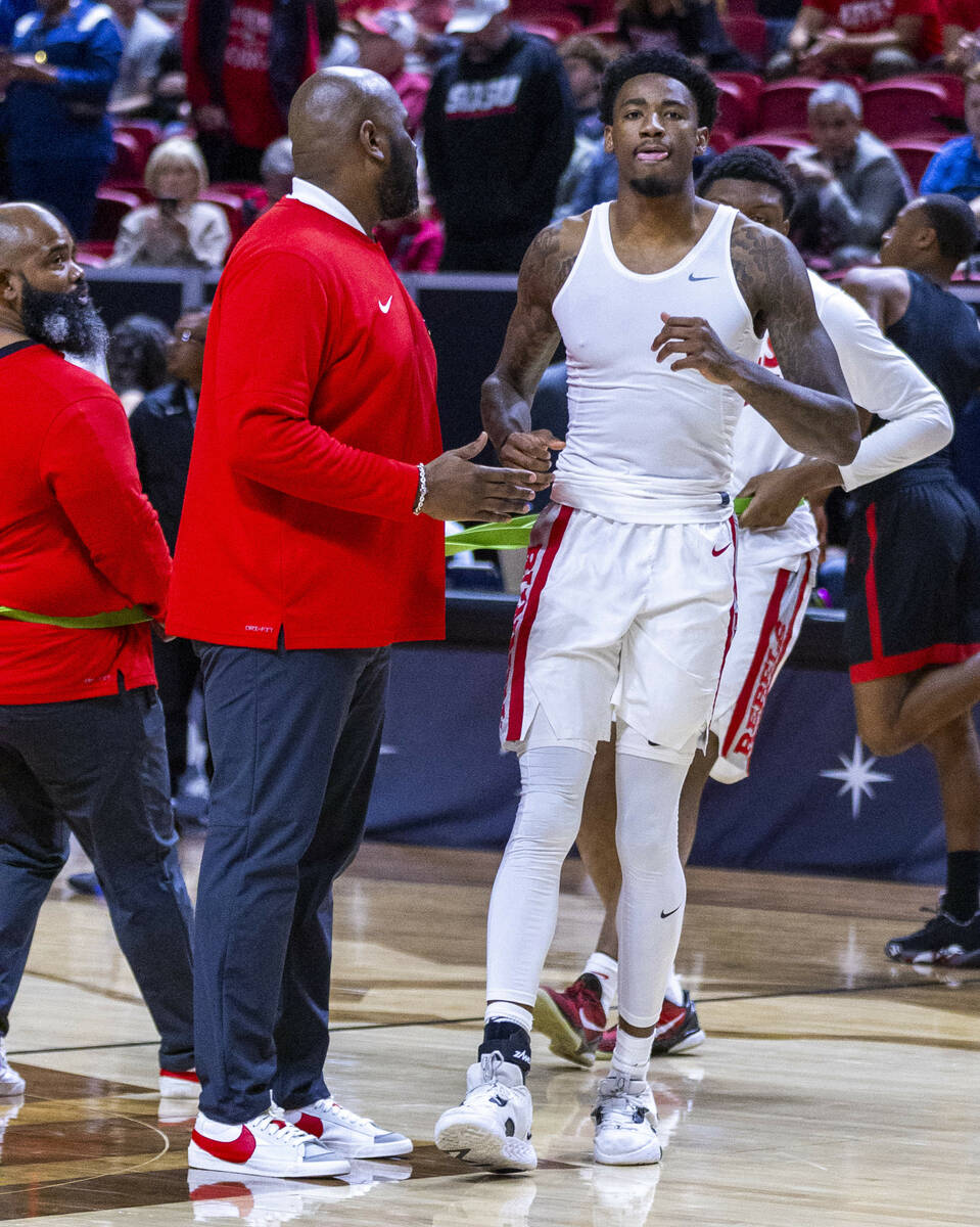 UNLV Rebels forward Kalib Boone (10) walks gingerly on an injured ankle as he attempts to warm ...