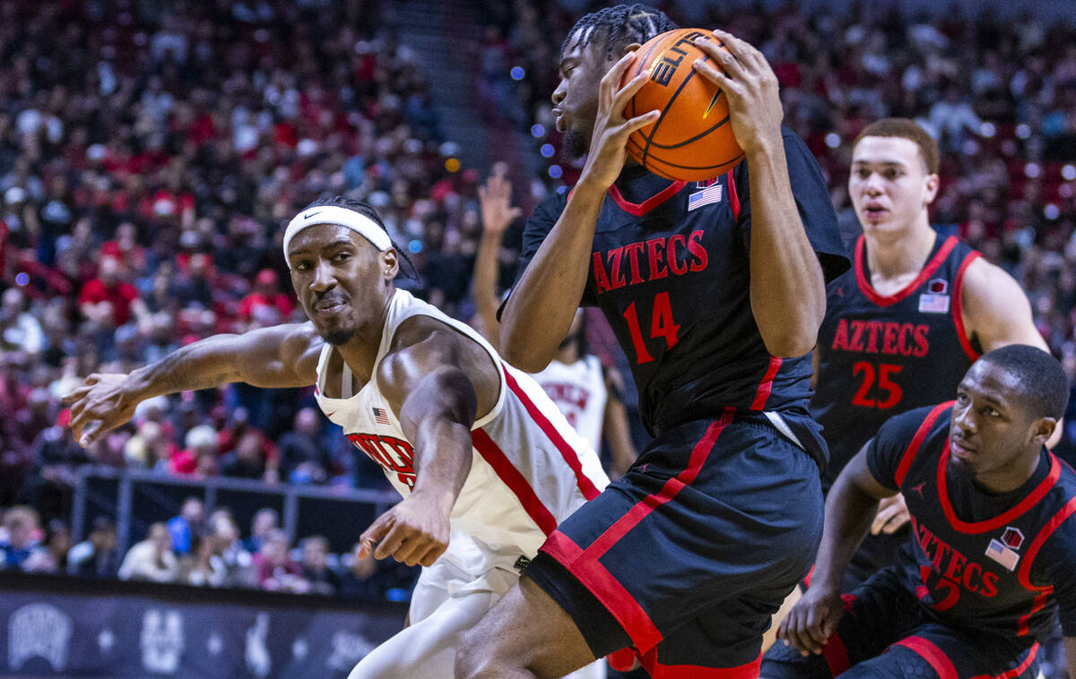 UNLV Rebels guard Shane Nowell (3) loses the ball on a drive to San Diego State Aztecs guard Re ...