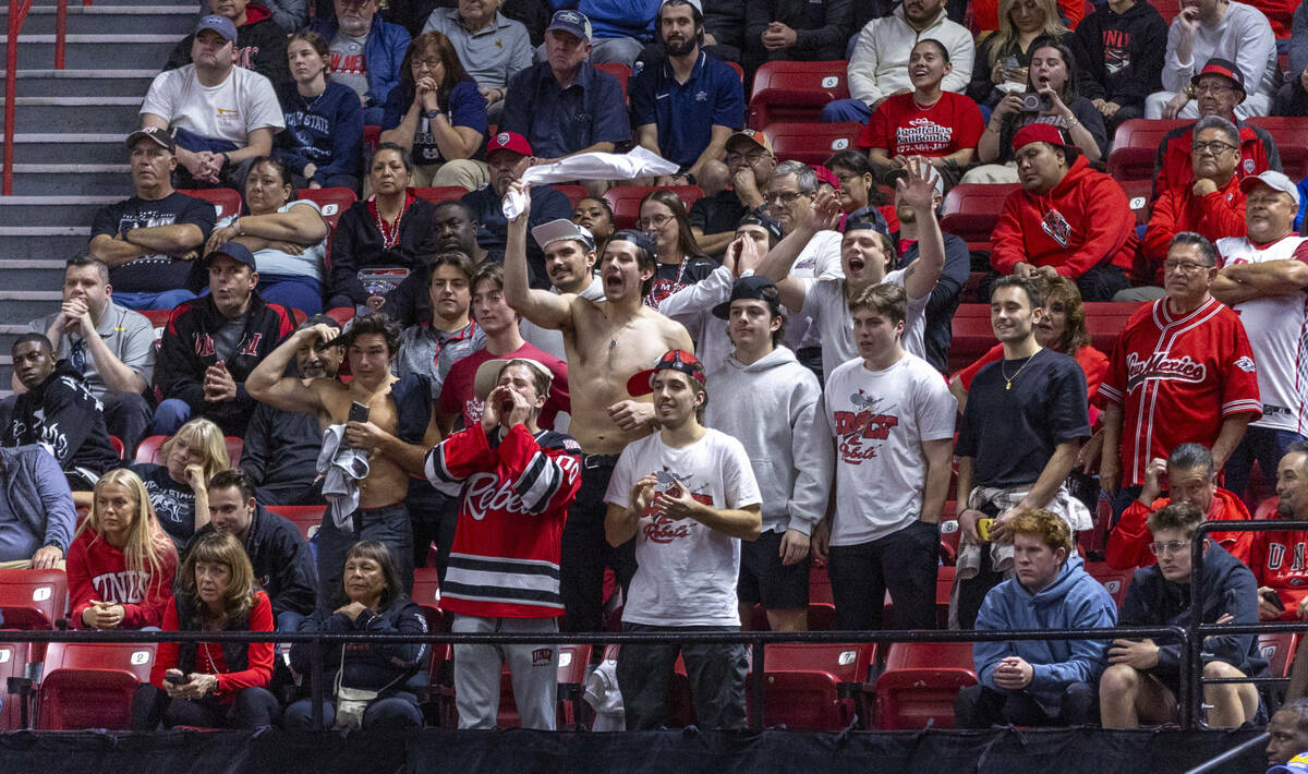 UNLV Rebels fans attempt to distract the San Diego State Aztecs on free throws late in overtime ...
