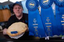 Manager Stephen Jarrett displays their National Pie Championships 1st place winning country app ...