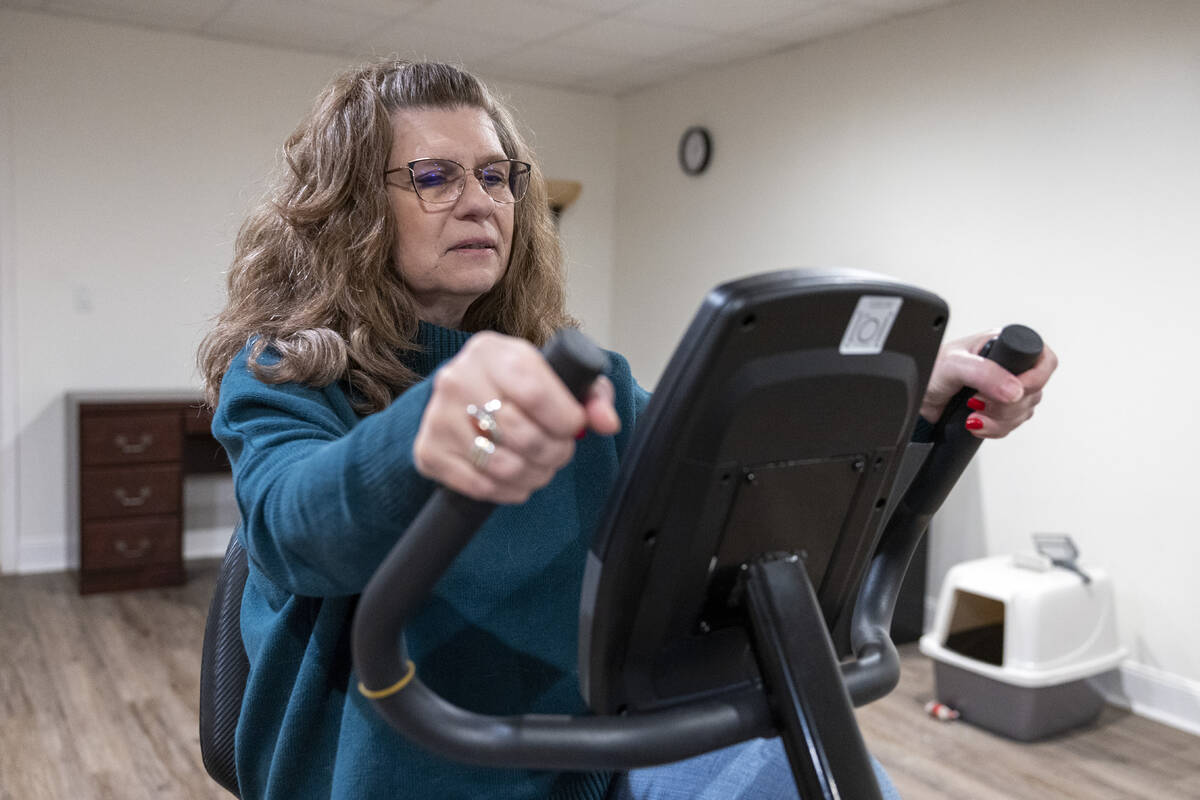 Donna Cooper shows her exercise bike at her home in Front Royal, Va., on Friday, March 1, 2024. ...