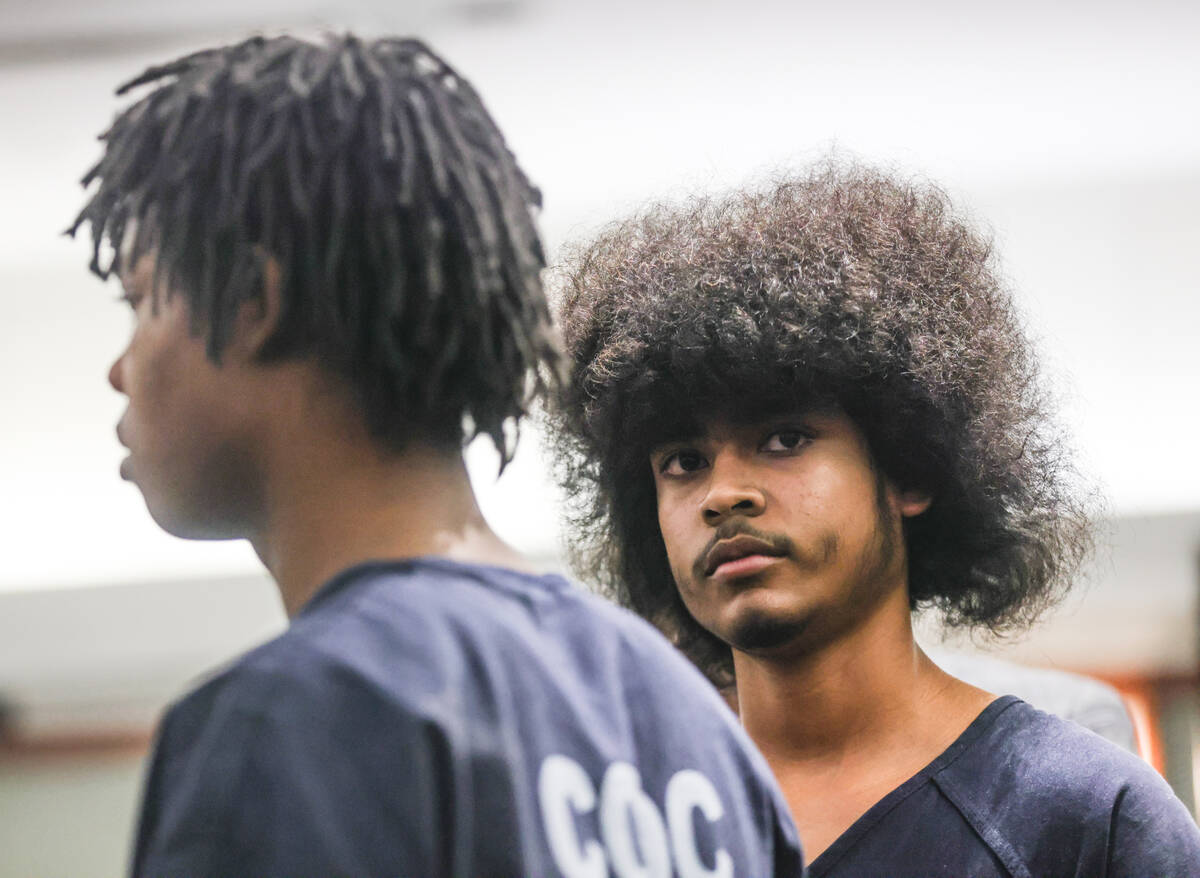 Treavion Randolph, 16, right and Dontral Beaver, 16, left, listen to court proceedings during ...