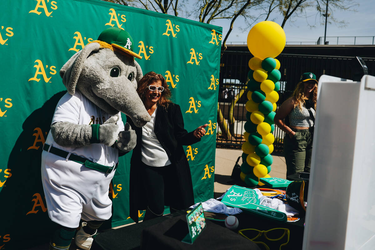 Oakland A’s mascot Stomper poses for photographs with fans during a Big League Weekend g ...