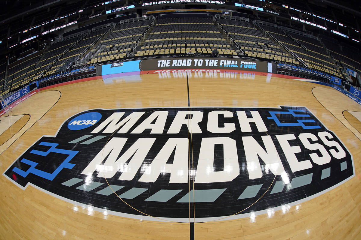 The basketball court at PPG Paints Arena in Pittsburgh is prepared on Thursday, March 17, 2022, ...