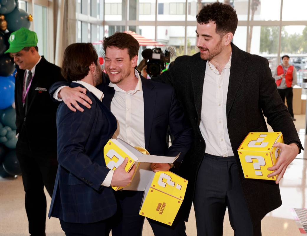 Medical students, from left, Skylar Davidson, Sean Slattery and Doug Saeks celebrate after find ...