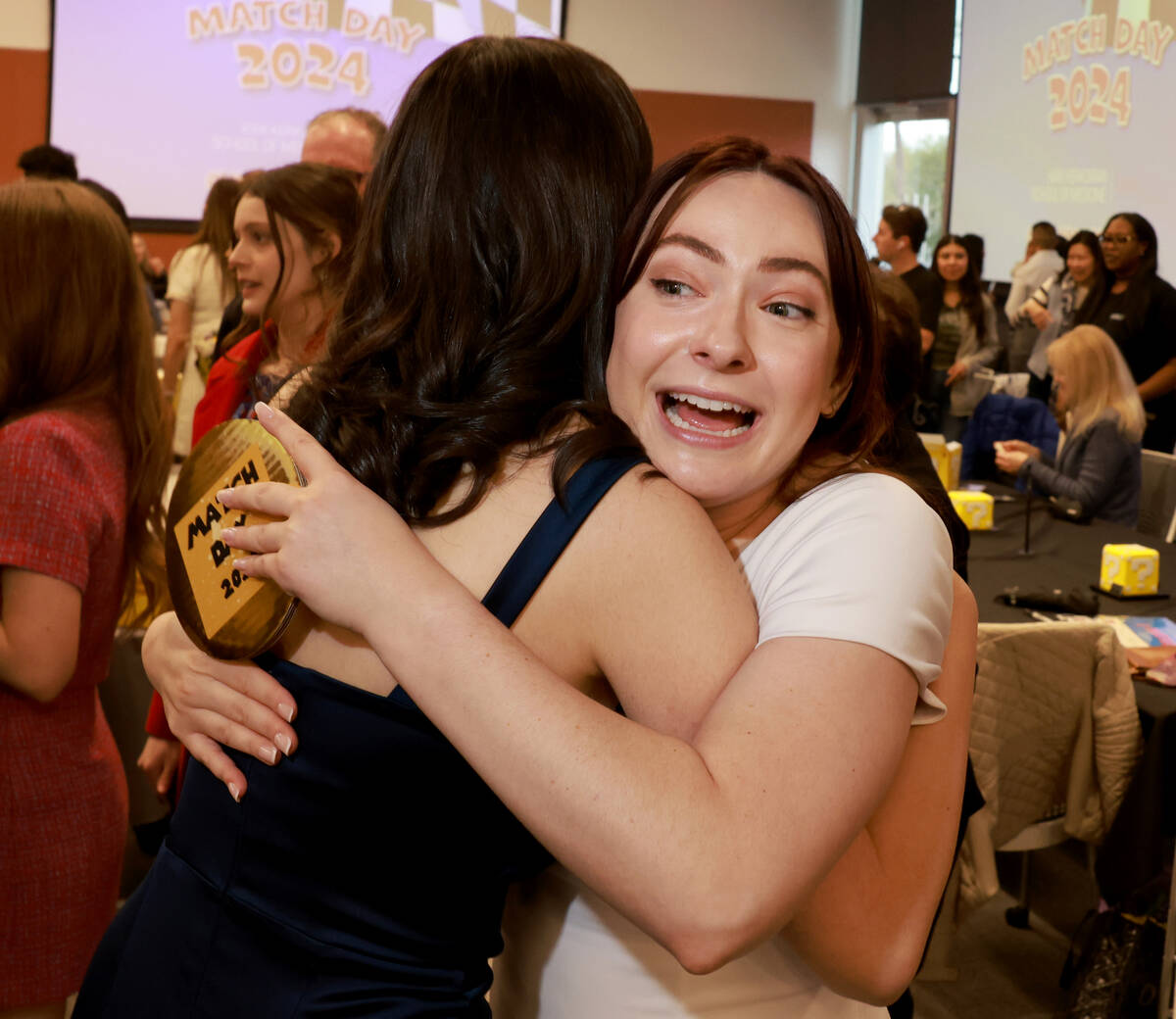 Medical students Bita Bashy, left, and Shelby Thomas celebrate after finding out where they wil ...