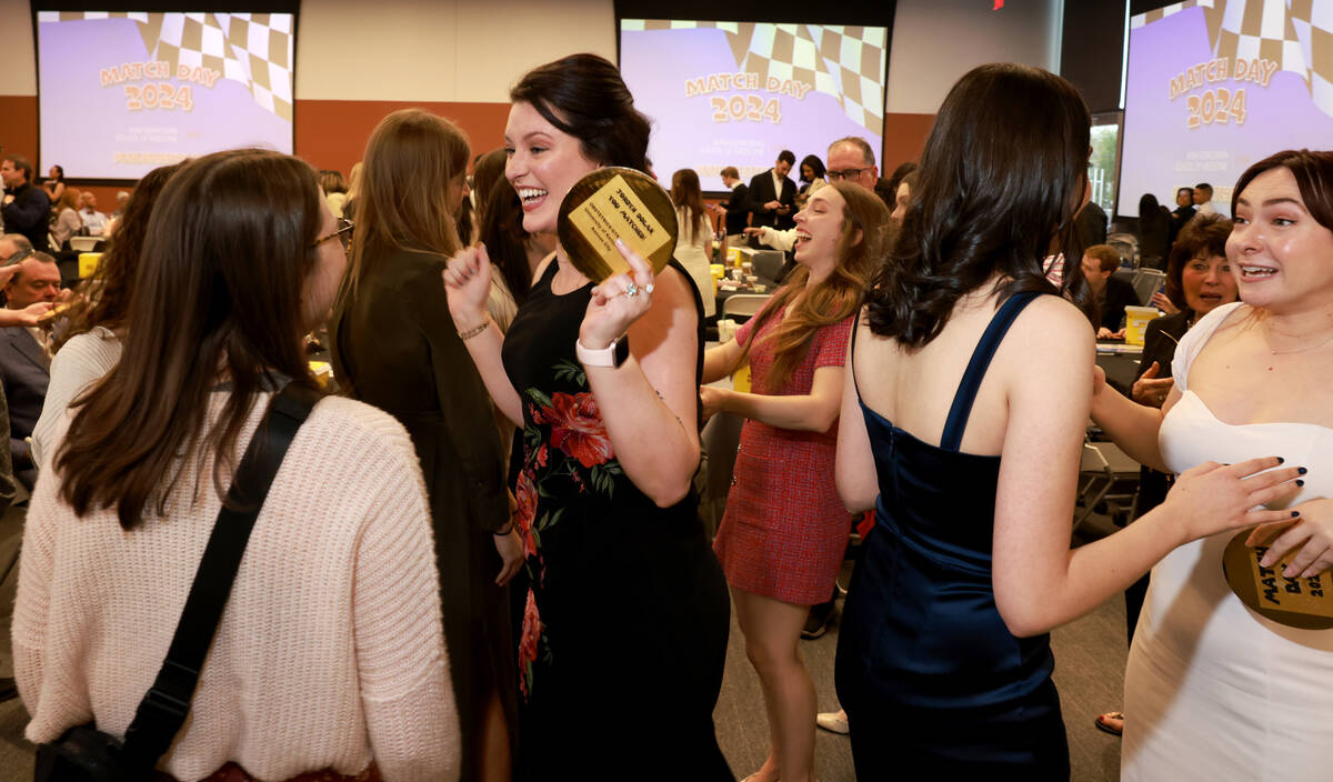 Medical students, including Jordyn Dolan, center, celebrate after finding out where they will p ...