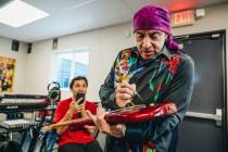 Stevie Van Zandt, a guitarist and member of Bruce Springsteen’s E Street Band, signs student ...
