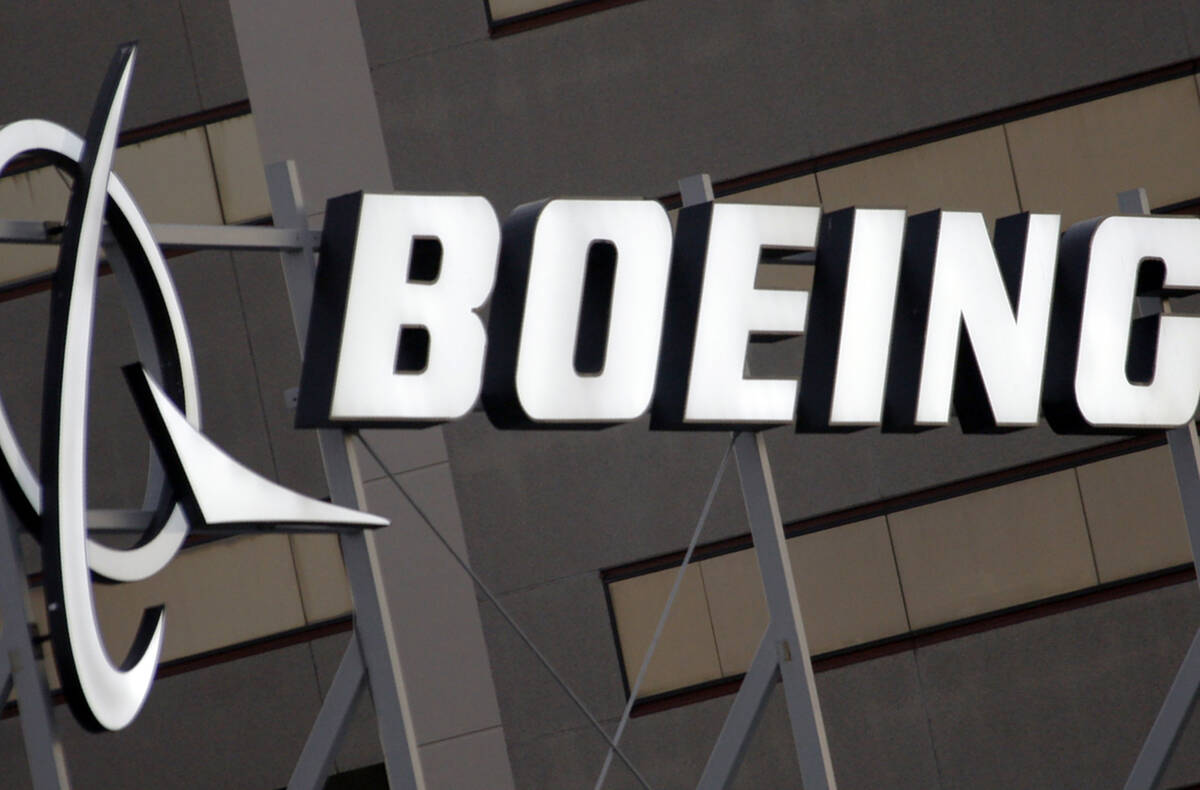 FILE - The Boeing logo is seen, Jan. 25, 2011, on the property in El Segundo, Calif. A Boeing 7 ...
