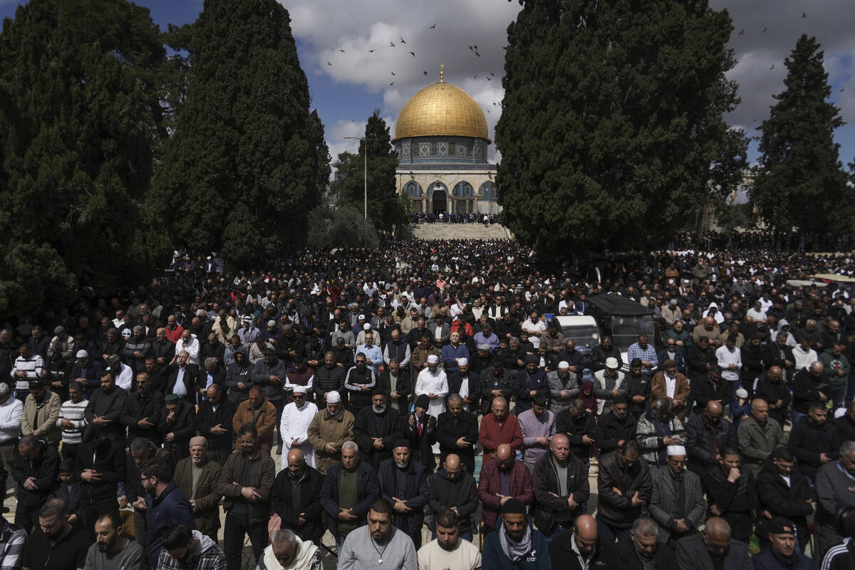 Muslim worshippers perform Friday prayers at the Al-Aqsa Mosque compound in the Old City of Jer ...