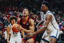San Diego State guard Micah Parrish (3) eyes the basket as he drives the ball during the Mounta ...