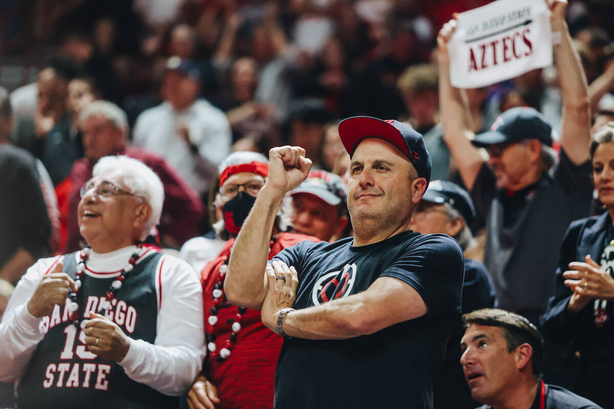 A San Diego State fan looks on with approval as the Aztecs lead Utah State during the Mountain ...