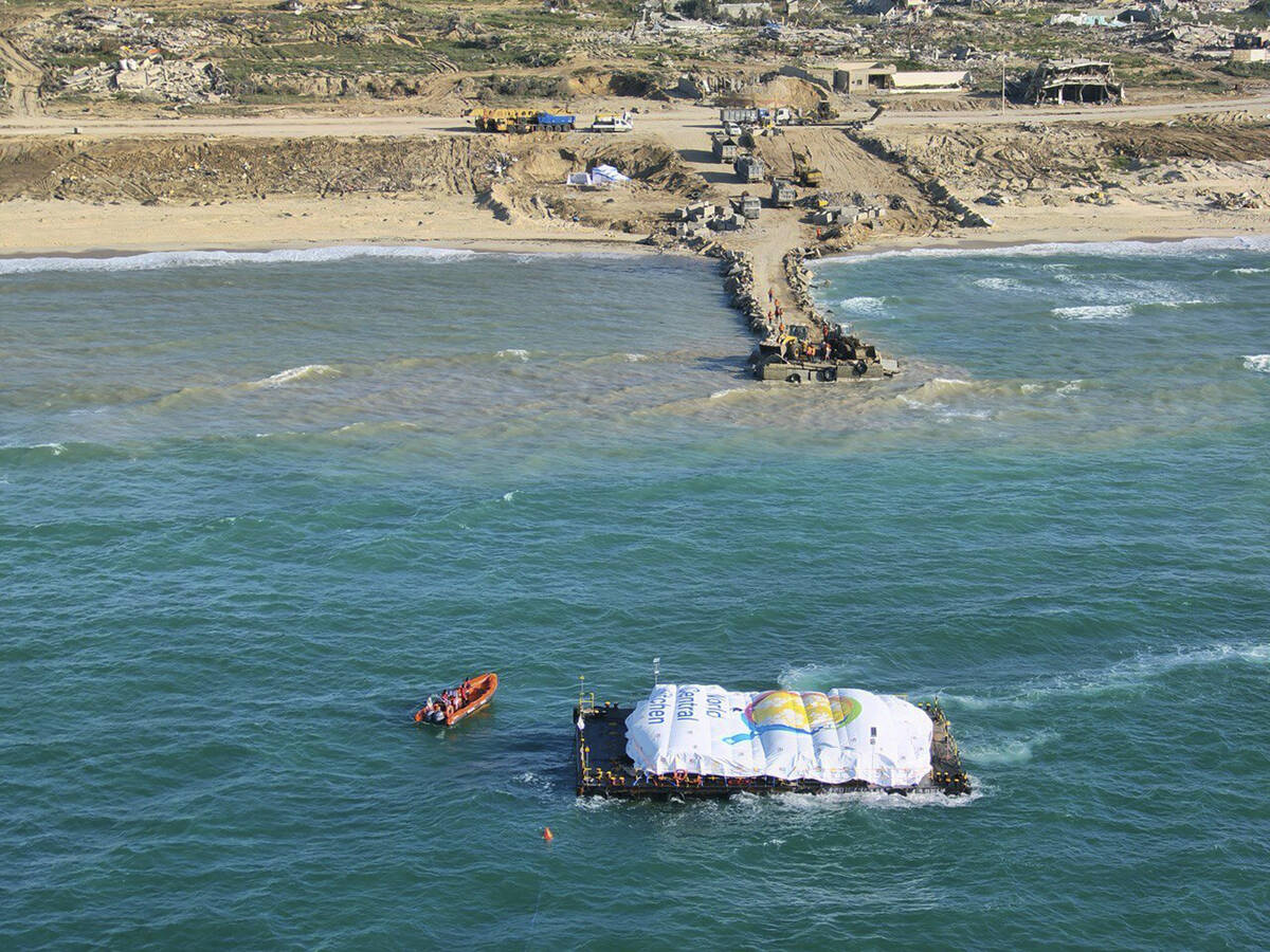 In this photo provided by the Israeli Army, humanitarian aid transported from a ship from the W ...