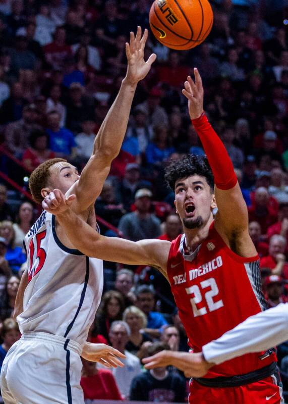 New Mexico Lobos forward Mustapha Amzil (22) gets inside of San Diego State Aztecs forward Elij ...