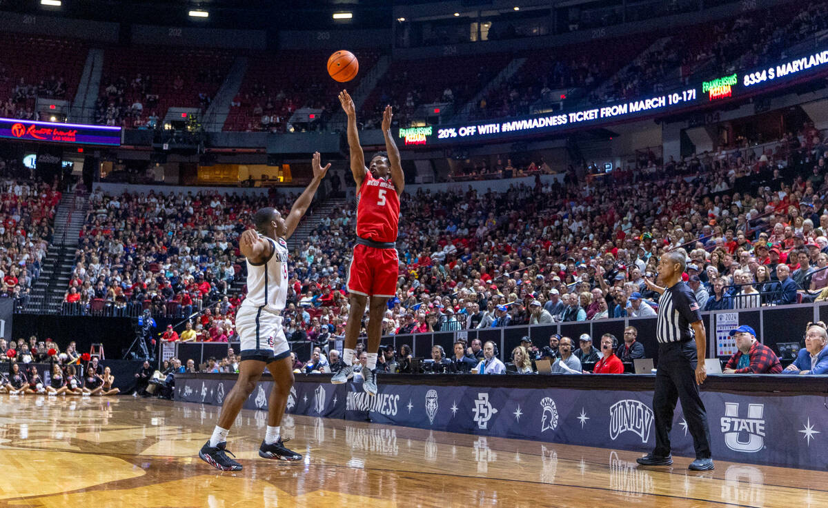 New Mexico Lobos guard Jamal Mashburn Jr. (5) elevates to get off a three-point basket attempt ...