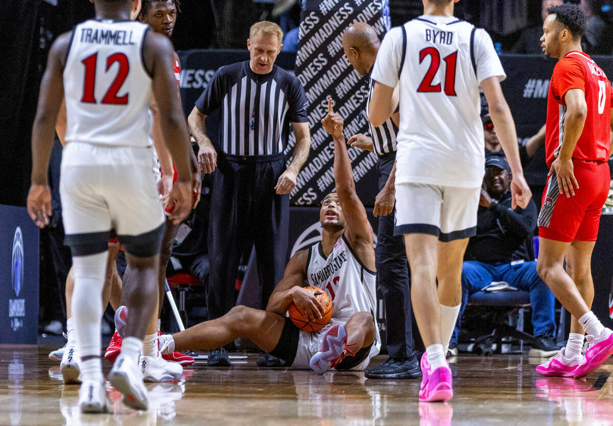 San Diego State Aztecs forward Jaedon LeDee (13) points to the replay convincing officials of a ...