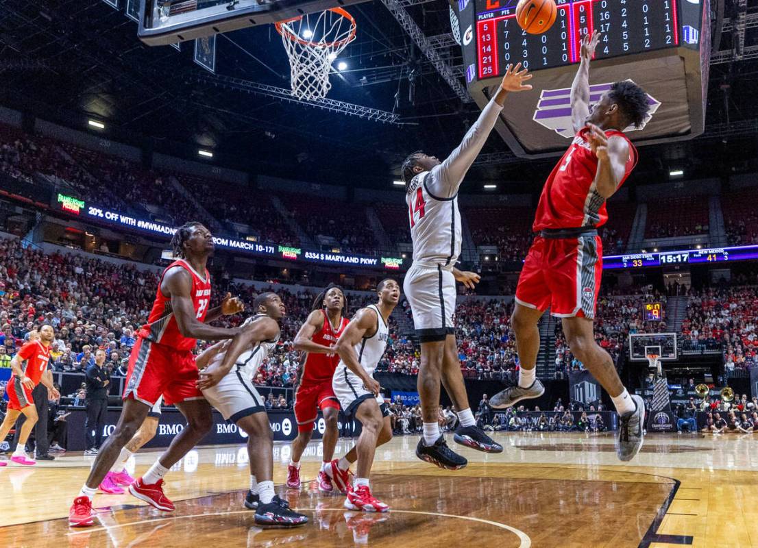 New Mexico Lobos guard Jamal Mashburn Jr. (5) elevates to get off a shot over San Diego State A ...