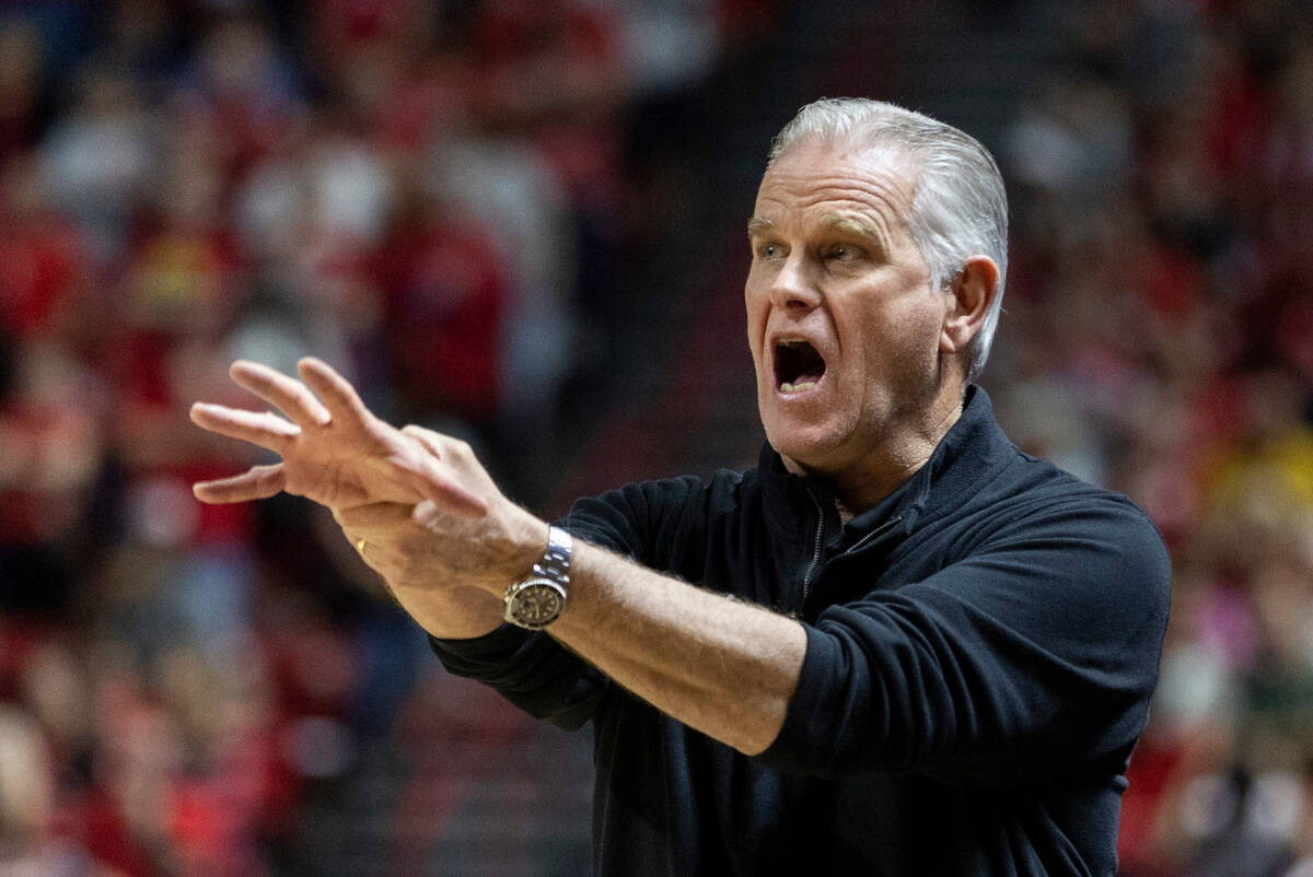 San Diego State Aztecs head coach Brian Dutcher calls out "the claw" to his players a ...