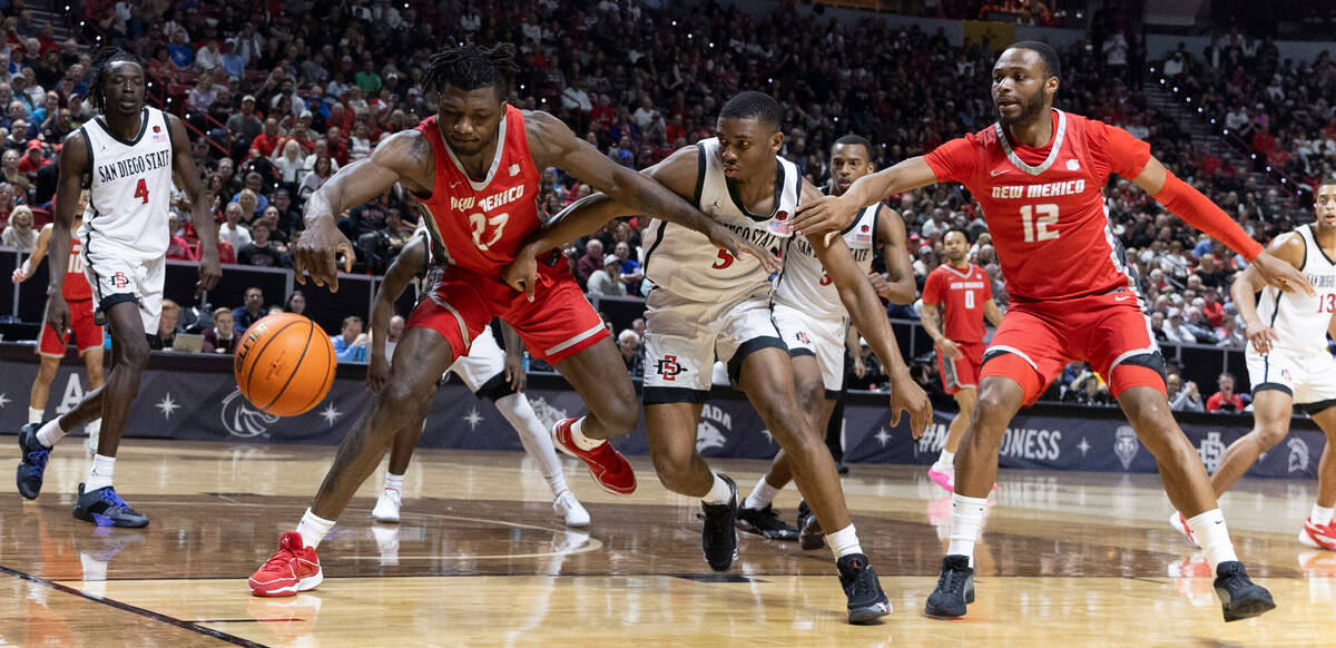 New Mexico Lobos center Nelly Junior Joseph (23) reaches for a loose ball against San Diego Sta ...