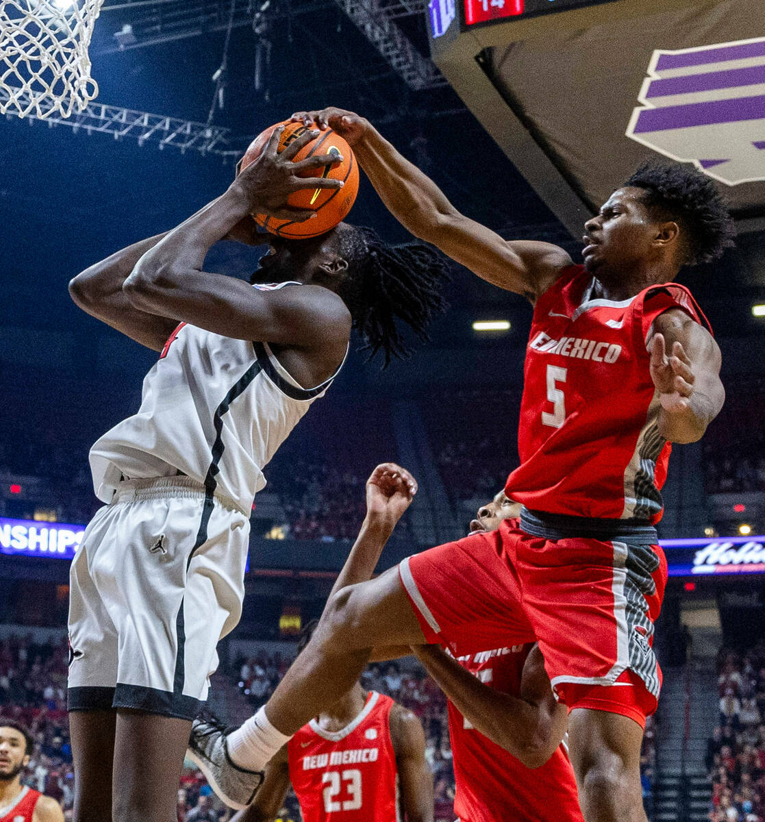 New Mexico Lobos guard Jamal Mashburn Jr. (5) rejects a shot attempt by San Diego State Aztecs ...