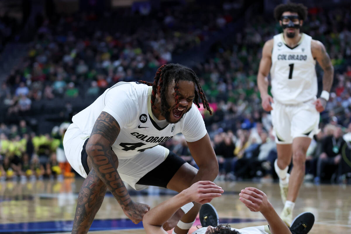 Colorado Buffaloes center Eddie Lampkin Jr. (44) cheers of this fallen teammate after they drew ...