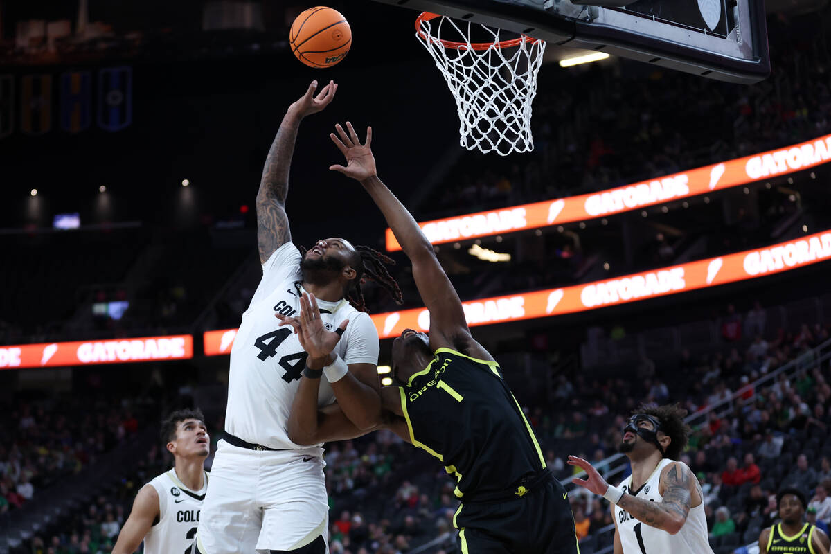 Colorado Buffaloes center Eddie Lampkin Jr. (44) jumps for a rebound against Oregon Ducks cente ...