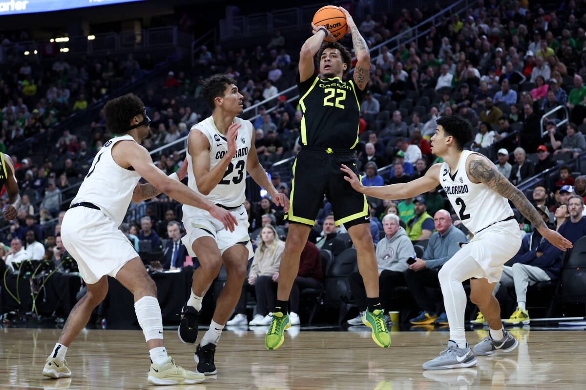 Oregon Ducks guard Jadrian Tracey (22) shoots against Colorado Buffaloes guard J'Vonne Hadley ( ...