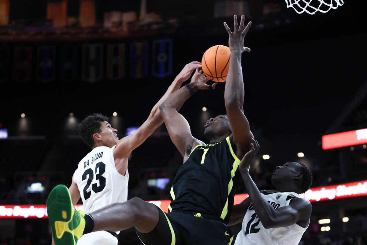 Oregon Ducks center N'Faly Dante (1) jumps for a rebound against Colorado Buffaloes forward Tri ...