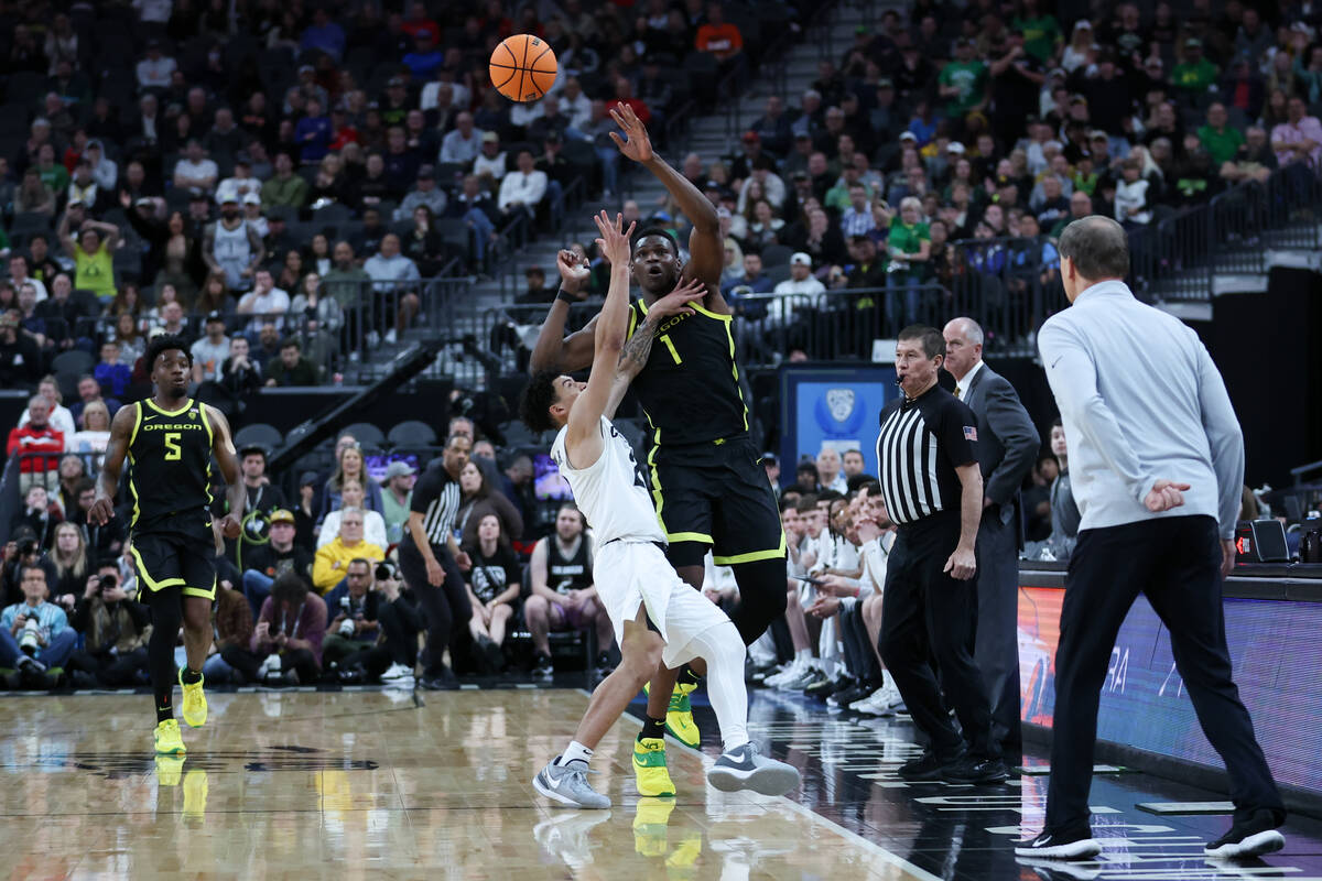 Oregon Ducks center N'Faly Dante (1) tips the ball away from Colorado Buffaloes guard KJ Simpso ...